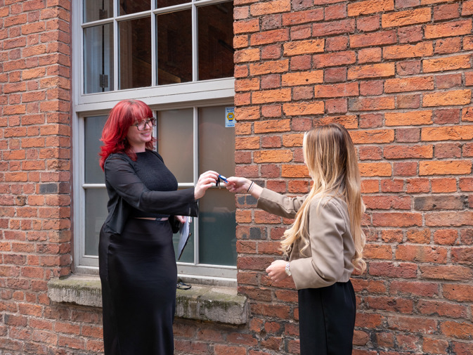 Handing over keys to a new tenant