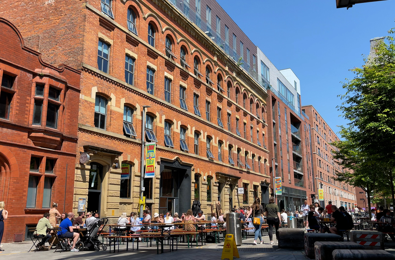 Ice Plant on Cutting Room Square with people eating and drinking outside in the sun
