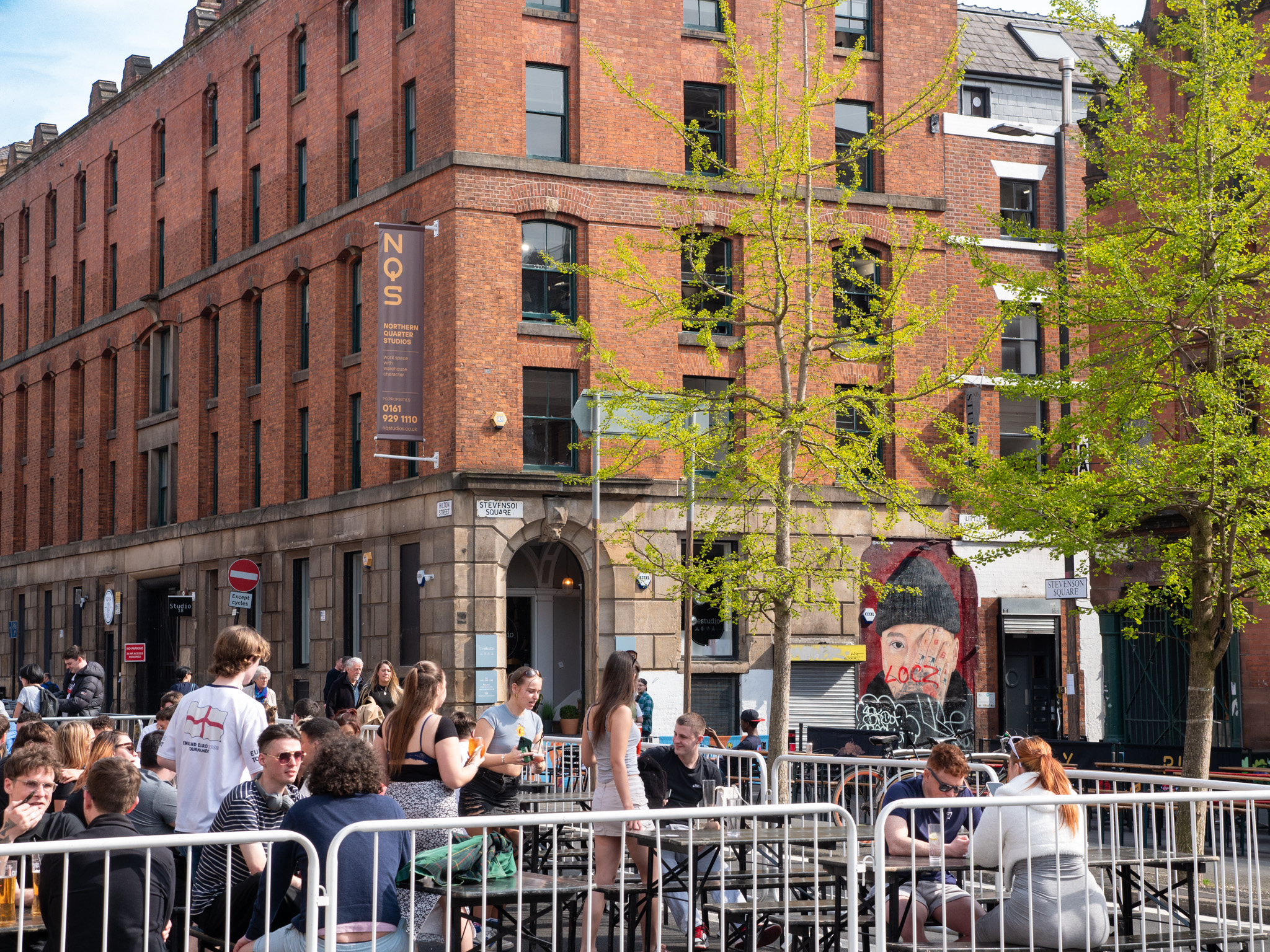 northern quarter stevenson square in summer with outside seating